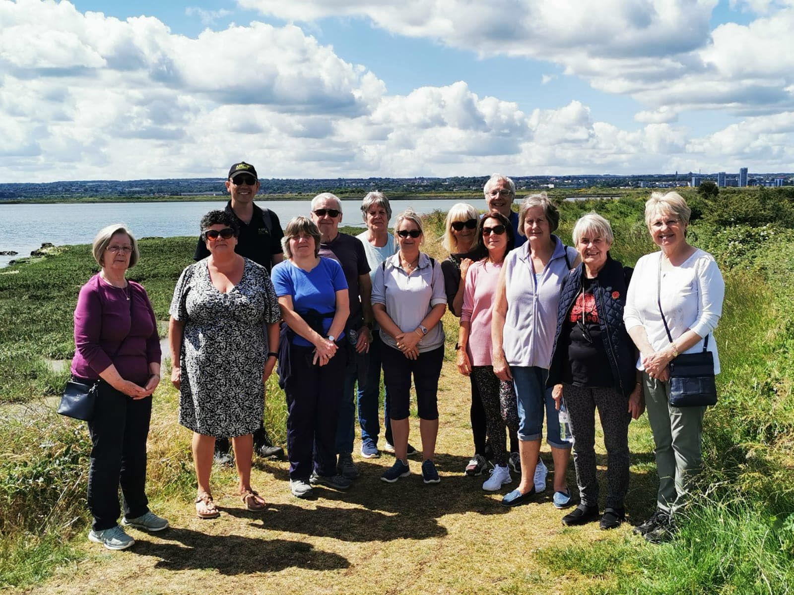 Walking Group Next to a River
